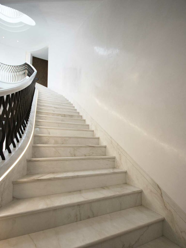 Polished plaster faux marble painted marble Hallway staircase tall stairs close up